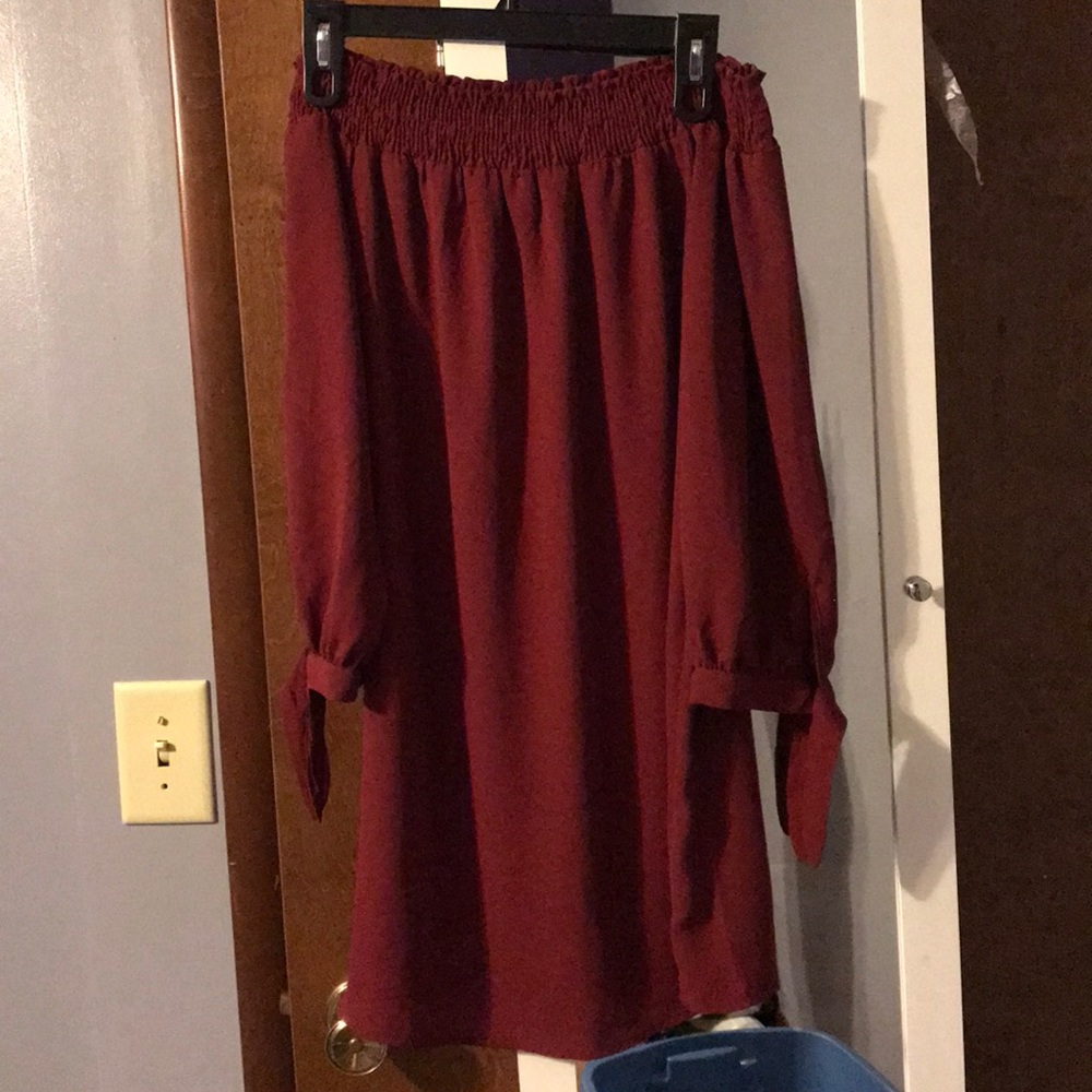 Wine color dress.